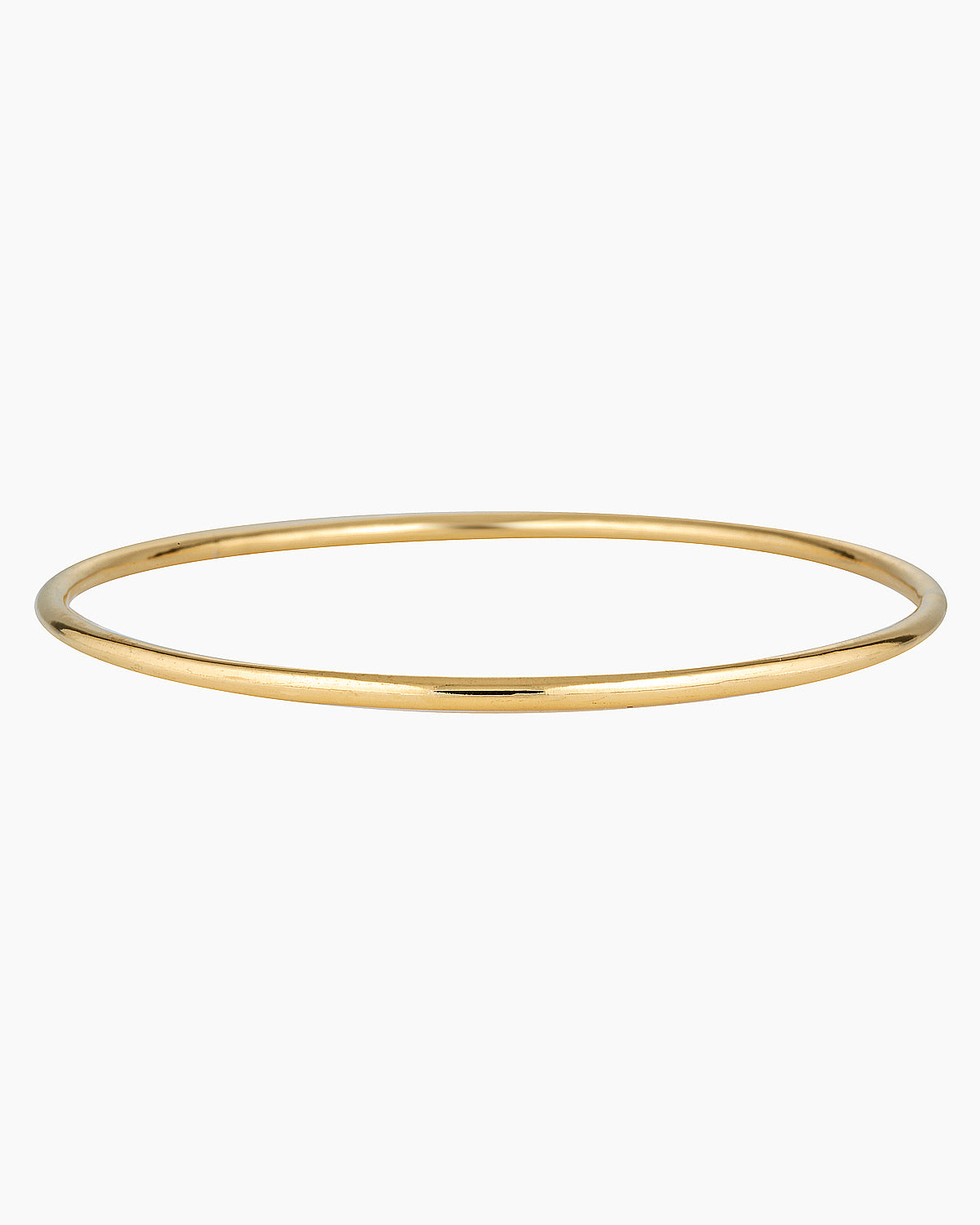 Minimalist slim gold bangle bracelet photographed on a white background, featuring a smooth polished finish and thin circular profile in 14K gold filled. Designed for women seeking a timeless everyday gold bracelet that layers easily with other bangles or can be worn alone for a clean, understated look. Ideal for those looking for durable, low-maintenance gold jewellery that is water safe, lightweight, and suitable for daily wear.
