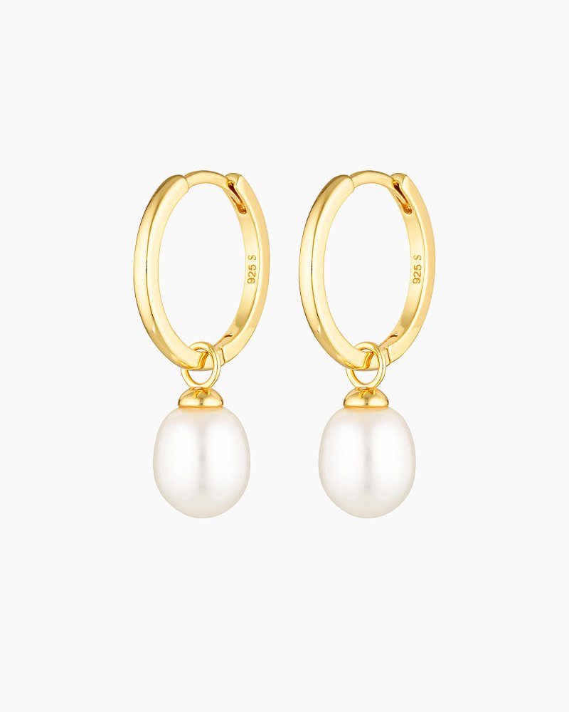 Elegant pair of gold pearl hoop earrings displayed on a clean white background, featuring smooth polished hoops with a dangling genuine freshwater pearl charm. Designed for women seeking minimalist pearl jewellery that works for everyday wear, weddings, bridal styling, or special occasions. These lightweight, hypoallergenic pearl hoop earrings offer a refined solution for adding softness and elegance to an ear stack without overpowering an outfit, making them ideal for those who want timeless hoops