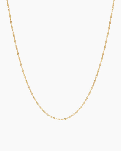 Product-only image of a delicate singapore rope rope chain necklace displayed in a U-shape against a clean white background. The fine twisted chain design highlights a lightweight, minimalist gold necklace suitable for everyday wear or layering with other necklaces. Designed for women seeking a simple, versatile gold chain that complements any outfit and solves the need for an easy, timeless base layer for jewellery stacking or standalone wear.