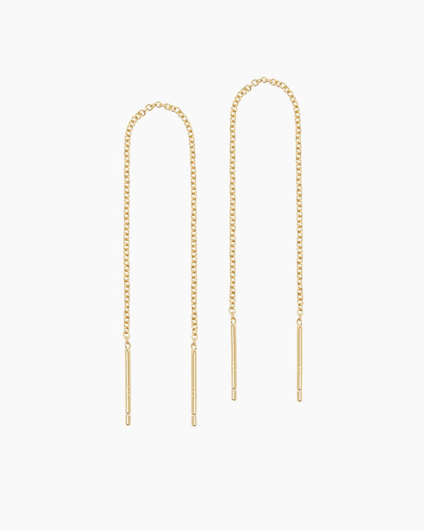 Pair of gold rolo chain threader earrings displayed on a clean white background, featuring slim bar ends and delicate elongated chains. Designed for people who prefer minimalist, lightweight jewellery, these thread earrings offer an elegant solution for creating a refined, modern look without bulky hardware. Ideal for everyday wear, sensitive ears, and effortless styling with dainty gold jewellery and layered ear stacks.