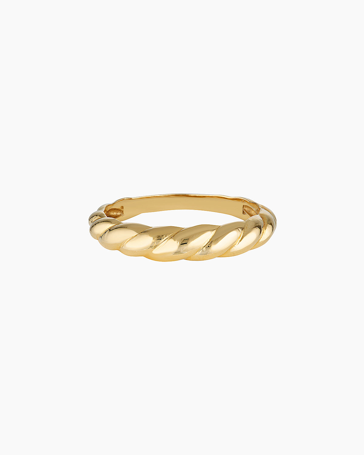 Slim twisted gold ring photographed on a clean white background, showing the Odette gold ring’s croissant-inspired design and polished finish. Designed for women seeking a minimalist gold stacking ring for everyday wear, this image highlights a durable 14K gold-filled twisted band that solves the need for a timeless, low-maintenance ring that layers easily or stands alone.