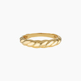 Slim twisted gold ring photographed on a clean white background, showing the Odette gold ring’s croissant-inspired design and polished finish. Designed for women seeking a minimalist gold stacking ring for everyday wear, this image highlights a durable 14K gold-filled twisted band that solves the need for a timeless, low-maintenance ring that layers easily or stands alone.