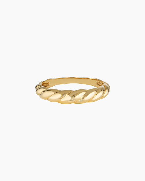 Slim twisted gold ring photographed on a clean white background, showing the Odette gold ring’s croissant-inspired design and polished finish. Designed for women seeking a minimalist gold stacking ring for everyday wear, this image highlights a durable 14K gold-filled twisted band that solves the need for a timeless, low-maintenance ring that layers easily or stands alone.