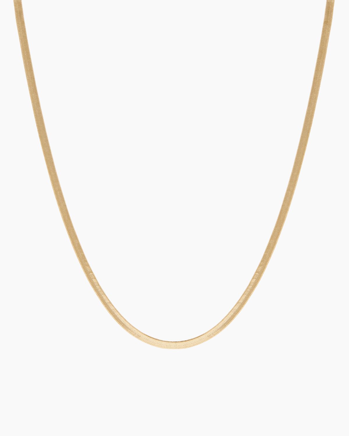 Product-only image of an 18K gold-filled snake chain necklace displayed in a smooth U-shape against a clean white background. The flat, polished snake chain design highlights a sleek, minimalist gold choker that sits flush on the chest. Designed for women seeking a timeless gold snake chain necklace that offers a refined statement look and solves the need for a versatile, everyday piece that can be worn alone or layered.